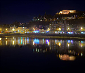 The lights of Oban reflected in the bay