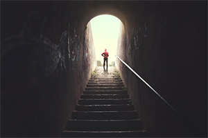 A man standing end of the stairs